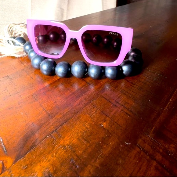 This is a Prada Sunglass. - Picture 2 of 5